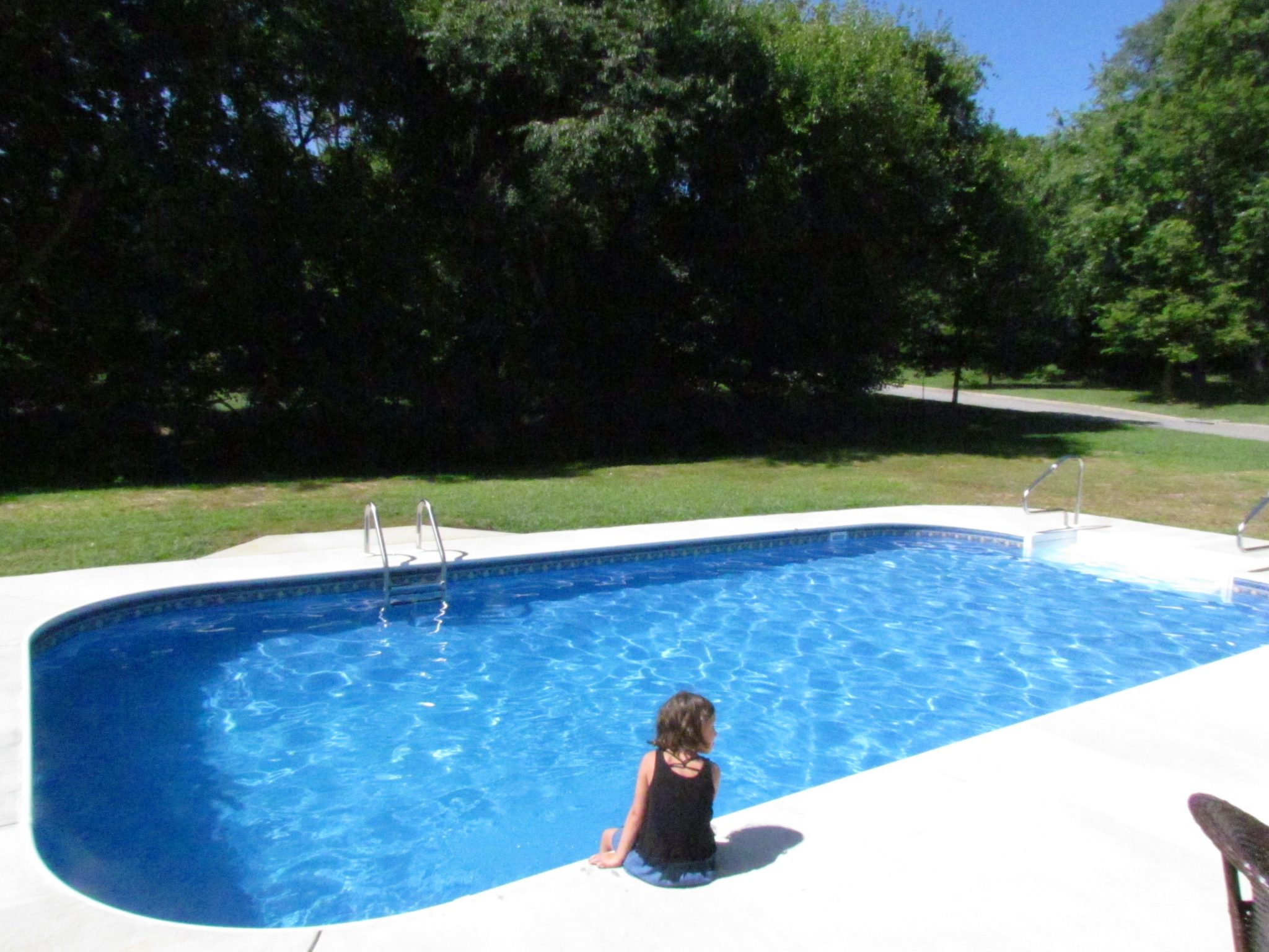Custom Home With In-Ground Pool kid at pool